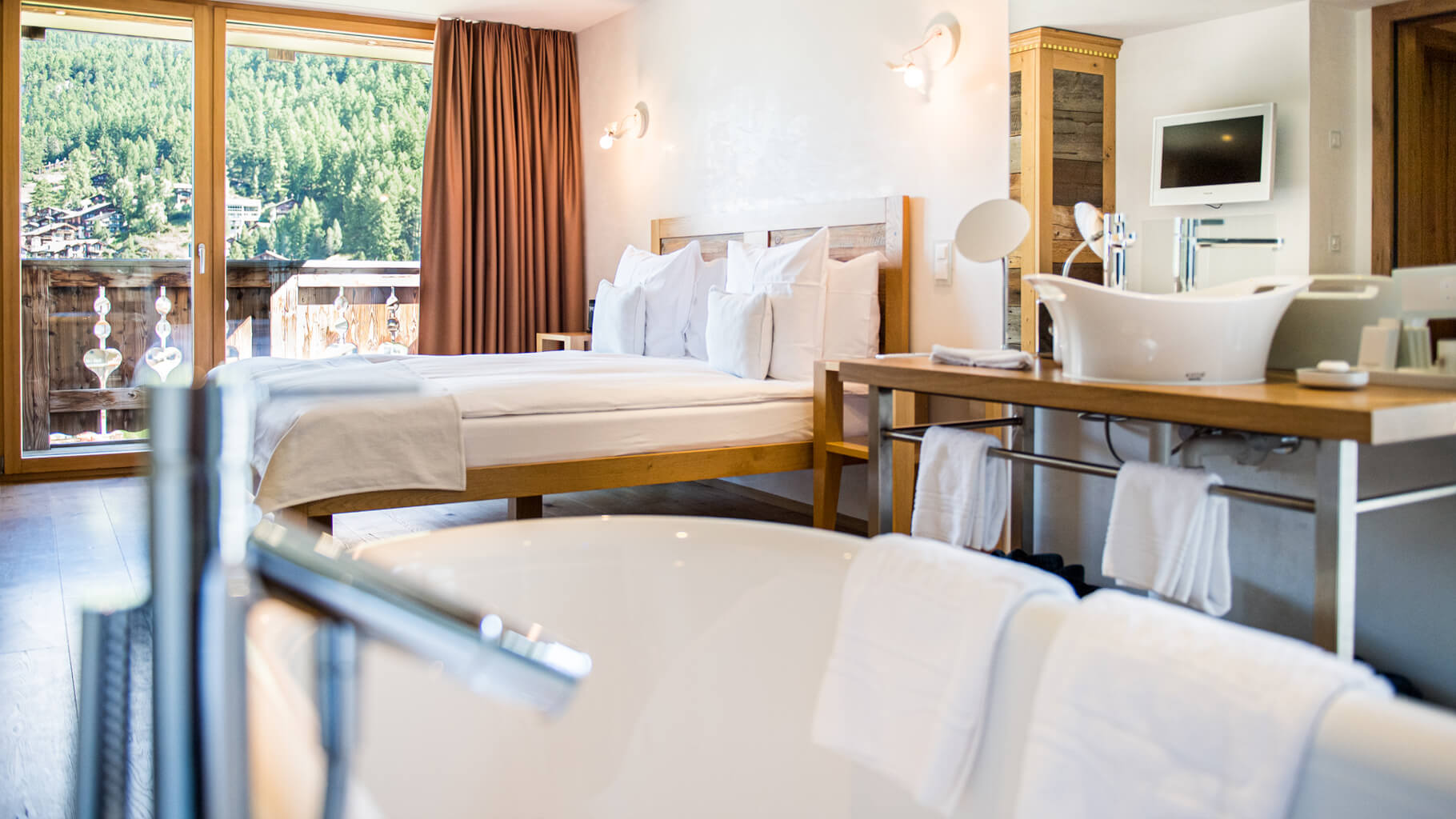 bed-bathroom-maxi-suite-deluxe-zermatt-firefly-switzerland-hotel.jpg